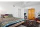 Bedroom with large bed, colorful bedding and armoire at 2533 Dolly Bay Dr # 203, Palm Harbor, FL 34684