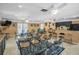 Spacious clubhouse with tables, chairs, ceiling fans, and a kitchenette perfect for gatherings and events at 2533 Dolly Bay Dr # 203, Palm Harbor, FL 34684
