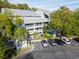Three-story condo featuring multiple balconies and well-maintained landscaping with convenient parking at 2533 Dolly Bay Dr # 203, Palm Harbor, FL 34684