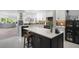 Modern kitchen with white cabinets, quartz countertops, stylish backsplash, and stainless steel appliances at 2533 Dolly Bay Dr # 203, Palm Harbor, FL 34684