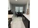 Bright kitchen boasts stainless appliances, granite countertops, and a cozy breakfast nook with a view at 2533 Dolly Bay Dr # 203, Palm Harbor, FL 34684