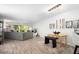 Spacious open-concept living room with wood floors and large windows offering plenty of natural light at 2533 Dolly Bay Dr # 203, Palm Harbor, FL 34684