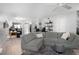 Spacious living room featuring modern decor, a large sectional sofa, and a ceiling fan at 2533 Dolly Bay Dr # 203, Palm Harbor, FL 34684