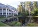 Condo complex backs up to well maintained pond with lush green landscaping at 2533 Dolly Bay Dr # 203, Palm Harbor, FL 34684