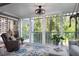 Cozy sunroom with lots of natural light, comfortable seating and view of the surrounding greenery at 2533 Dolly Bay Dr # 203, Palm Harbor, FL 34684