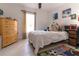 Cozy bedroom featuring a comfortable bed, natural light, and playful decor at 27709 Robin Roost Ln, Wesley Chapel, FL 33544