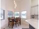 Bright dining area featuring a wooden table set and natural light at 27709 Robin Roost Ln, Wesley Chapel, FL 33544