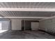 Roomy carport with attached garage, perfect for multiple vehicles or outdoor workspace and with lots of potential at 27709 Robin Roost Ln, Wesley Chapel, FL 33544