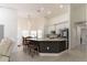 Modern kitchen with a breakfast bar with seating overlooking the dining room at 27709 Robin Roost Ln, Wesley Chapel, FL 33544