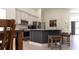 Modern kitchen featuring a breakfast bar with seating and stainless steel appliances at 27709 Robin Roost Ln, Wesley Chapel, FL 33544