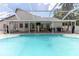 Enjoy backyard living with this screened-in pool and patio area, ideal for gatherings and leisure at 27709 Robin Roost Ln, Wesley Chapel, FL 33544