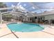 Large screened-in pool with attached house provides a perfect space for Gathering fun and relaxation at 27709 Robin Roost Ln, Wesley Chapel, FL 33544