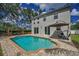 Backyard retreat with pool, deck, and lovely landscaping at 3002 Savannah Oaks Cir, Tarpon Springs, FL 34688
