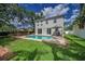 Beautiful backyard with pool, deck, and gazebo, perfect for outdoor entertaining at 3002 Savannah Oaks Cir, Tarpon Springs, FL 34688