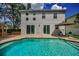 Enjoy outdoor living with a pool, patio, and well-maintained backyard at 3002 Savannah Oaks Cir, Tarpon Springs, FL 34688