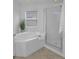 Garden tub and glass shower highlight this bright bathroom at 3002 Savannah Oaks Cir, Tarpon Springs, FL 34688