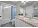Bright bathroom with tub/shower combo, vanity, and updated fixtures at 3002 Savannah Oaks Cir, Tarpon Springs, FL 34688