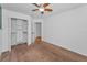 Spacious bedroom boasts a closet, neutral paint, and plush carpet flooring at 3002 Savannah Oaks Cir, Tarpon Springs, FL 34688