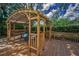 Charming outdoor deck with seating area offers a peaceful retreat amidst lush surroundings at 3002 Savannah Oaks Cir, Tarpon Springs, FL 34688