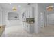 Eat-in kitchen with white cabinetry, granite countertops and breakfast bar overlooking pool and lanai at 3002 Savannah Oaks Cir, Tarpon Springs, FL 34688