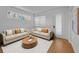 Bright living room featuring light wood flooring, neutral walls, recessed lighting, window, and modern furniture at 3002 Savannah Oaks Cir, Tarpon Springs, FL 34688