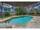 Backyard pool area features lush greenery, gazebo and plenty of room to relax at 3002 Savannah Oaks Cir, Tarpon Springs, FL 34688