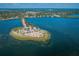 Expansive aerial view of a beach, clear waters, and lush greenery, a serene coastal getaway at 314 Bath St, Tarpon Springs, FL 34689
