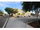 View of a yellow building exterior and parking lot near downtown with trees and blue sky above at 314 Bath St, Tarpon Springs, FL 34689