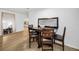 Dining space featuring a rustic table and chairs, wood-look tile floor, and a mirror at 314 Bath St, Tarpon Springs, FL 34689
