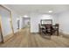 Bright dining area with tile flooring and a dark wood table and chairs. The mirror reflects light throughout the home at 314 Bath St, Tarpon Springs, FL 34689