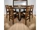 Close-up shot of a rustic wood dining table with leather chairs, a great spot for intimate meals or gatherings at 314 Bath St, Tarpon Springs, FL 34689