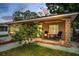 Inviting home exterior with a charming porch and comfortable seating, perfect for enjoying the outdoors at 314 Bath St, Tarpon Springs, FL 34689