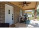 Inviting front porch with a ceiling fan, seating, and stylish tile flooring at 314 Bath St, Tarpon Springs, FL 34689