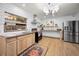 Updated kitchen featuring stainless steel appliances, custom cabinets, and ample counter space at 314 Bath St, Tarpon Springs, FL 34689