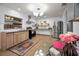 Bright kitchen featuring stainless appliances, tile floors, and natural wood cabinets and details at 314 Bath St, Tarpon Springs, FL 34689