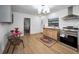 Stylish kitchen featuring tile floors, stainless appliances, and natural wood cabinets and details at 314 Bath St, Tarpon Springs, FL 34689
