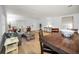 Open concept living and dining area with wood look tile floors and plenty of natural light and space at 314 Bath St, Tarpon Springs, FL 34689