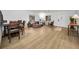 Open-concept living and dining area featuring hardwood flooring, lots of seating, and a light and airy atmosphere at 314 Bath St, Tarpon Springs, FL 34689