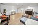 Open-concept living space with wood-look flooring, comfortable seating, and a seamless flow for modern living at 314 Bath St, Tarpon Springs, FL 34689