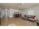 Spacious living room with wood floors, stylish furniture, and plenty of natural light at 314 Bath St, Tarpon Springs, FL 34689