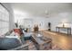 Bright living room with modern decor, sleek flooring, and comfortable seating arrangements at 314 Bath St, Tarpon Springs, FL 34689