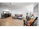 Comfortable living room with sleek wood-look flooring, modern furniture, and ample natural light at 314 Bath St, Tarpon Springs, FL 34689