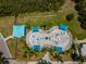 Aerial view of a new splash pad featuring multiple water elements and colorful sunshades at 314 Bath St, Tarpon Springs, FL 34689