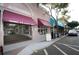 Charming storefront with awnings and a cafe entrance, showcasing a bustling downtown area at 314 Bath St, Tarpon Springs, FL 34689