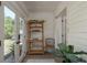 Sunroom with a view of the yard, white paneling, and tile floor at 314 Bath St, Tarpon Springs, FL 34689