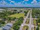 Aerial view of the home's location in a vibrant neighborhood with mature trees and clear blue skies at 316 Lafayette Blvd, Oldsmar, FL 34677