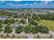 Aerial view of property showing proximity to amenities, lush greenery, and neighborhood streets at 316 Lafayette Blvd, Oldsmar, FL 34677