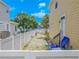 View of backyard with white fence, shed, and potential for garden area, perfect for outdoor activities at 316 Lafayette Blvd, Oldsmar, FL 34677