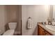 Bathroom featuring a toilet, vanity, and decorative fixtures at 316 Lafayette Blvd, Oldsmar, FL 34677
