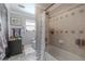 Bathroom featuring a shower-tub combo with decorative tile work and modern fixtures at 316 Lafayette Blvd, Oldsmar, FL 34677